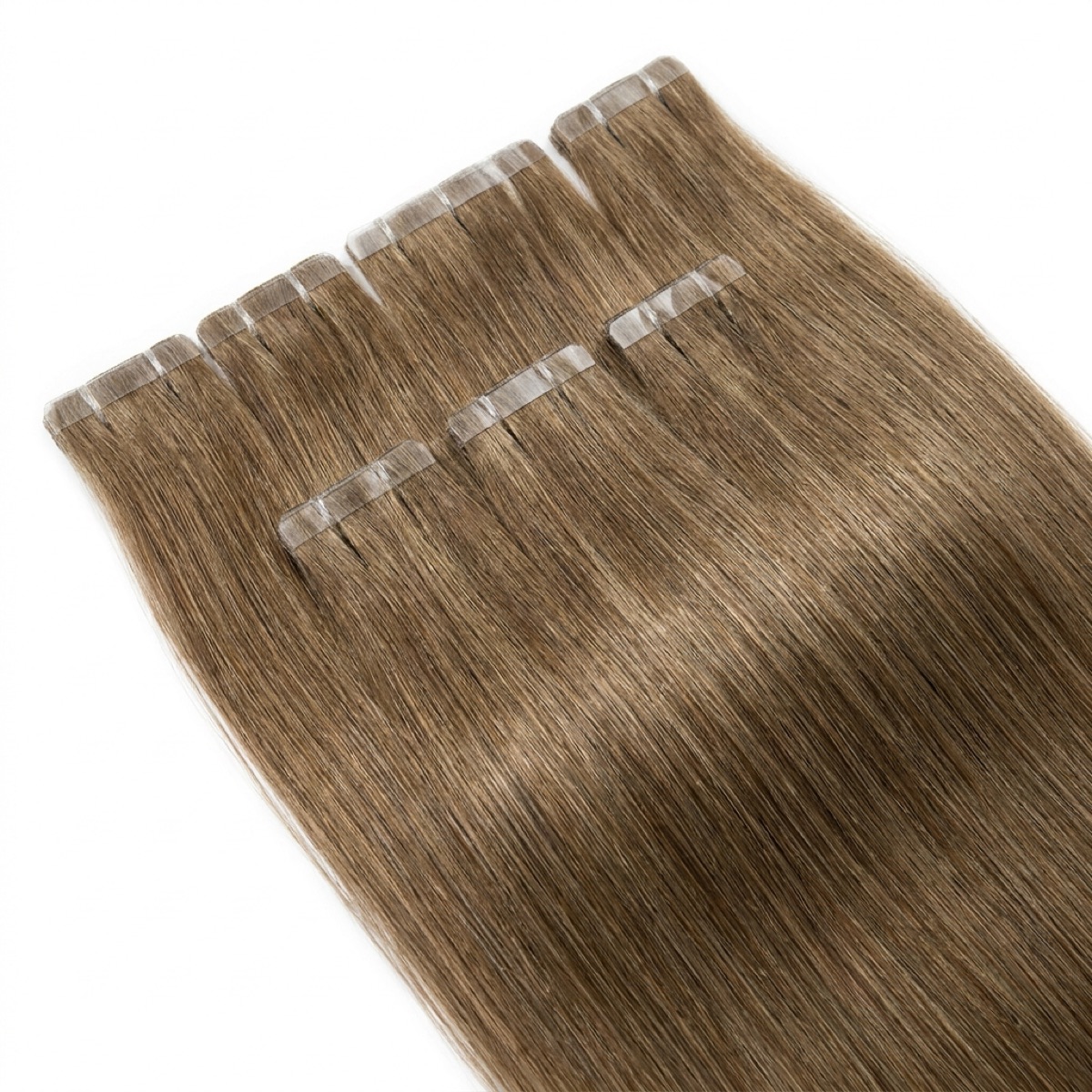 Extensiones adhesivas Extensiones adhesivas tape-in de cabello rubio oscuro sobre fondo blanco